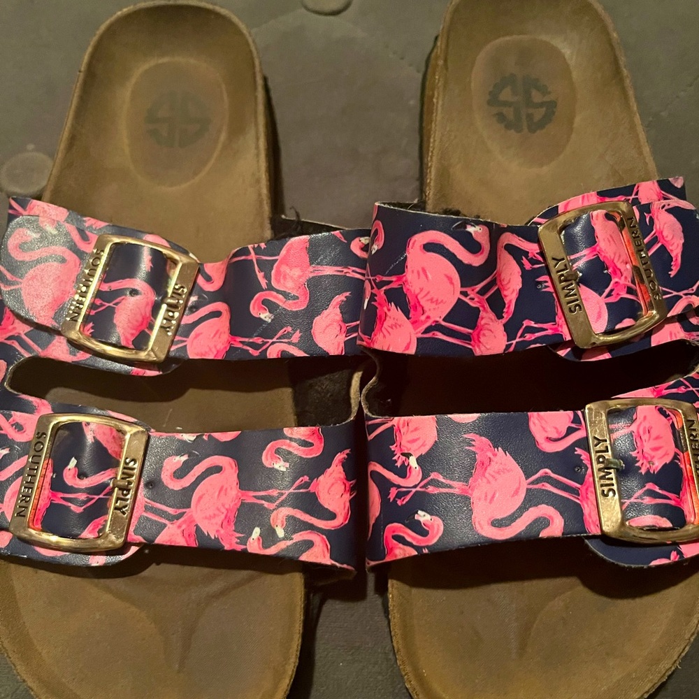 Gently used pink flamingo slip on sandals.